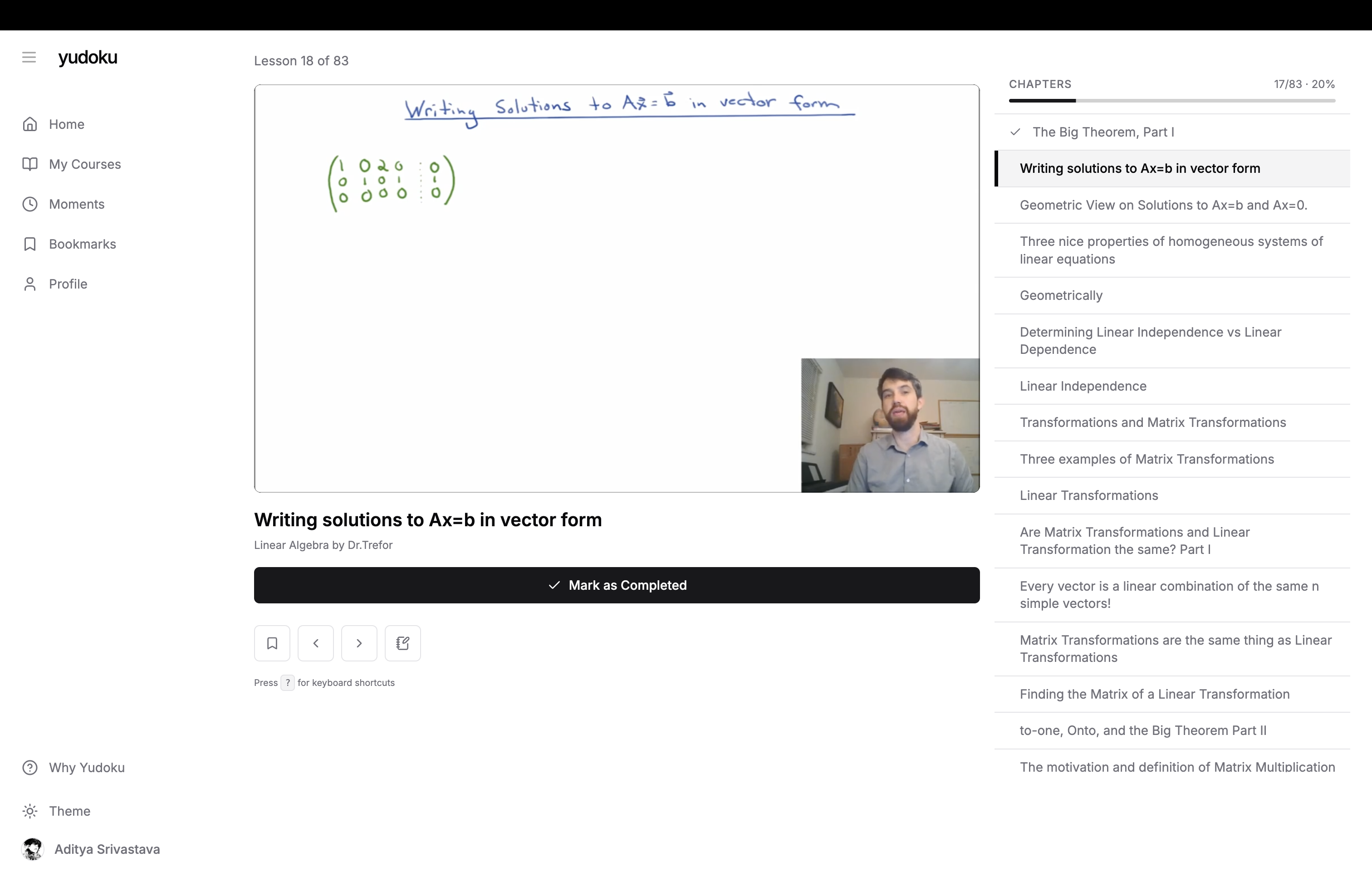the lesson view — the playlist as chapters down the right side, your position in it, and a single explicit "mark as completed" action. nothing else competes for attention.